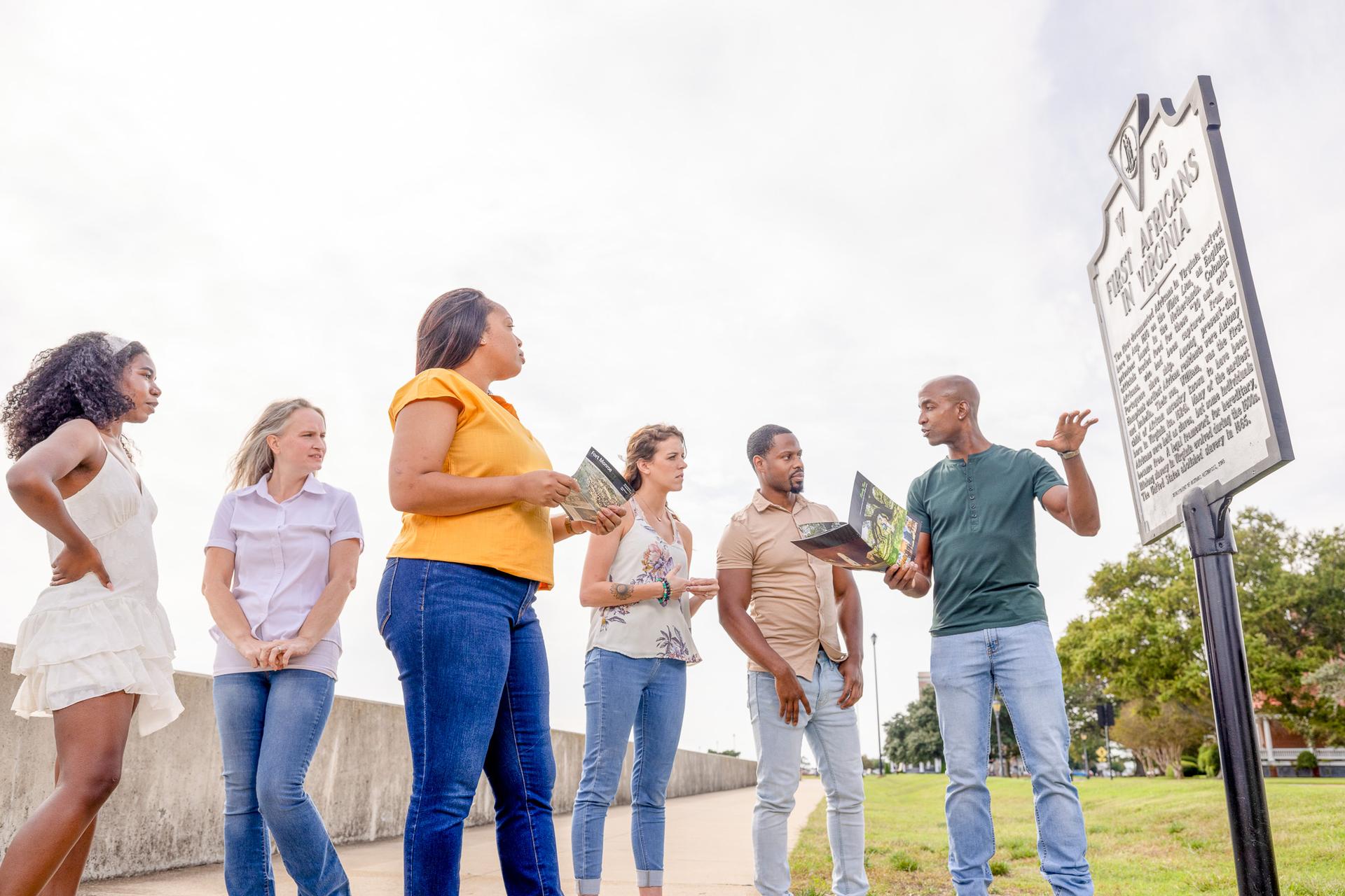 Group at Fort Monroe reading First Africans in Virginia historic marker