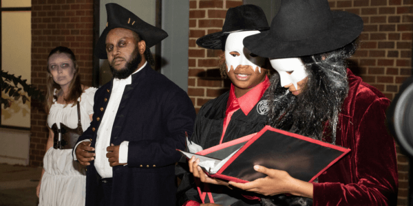 Costumed guides at a ghostly history tour.
