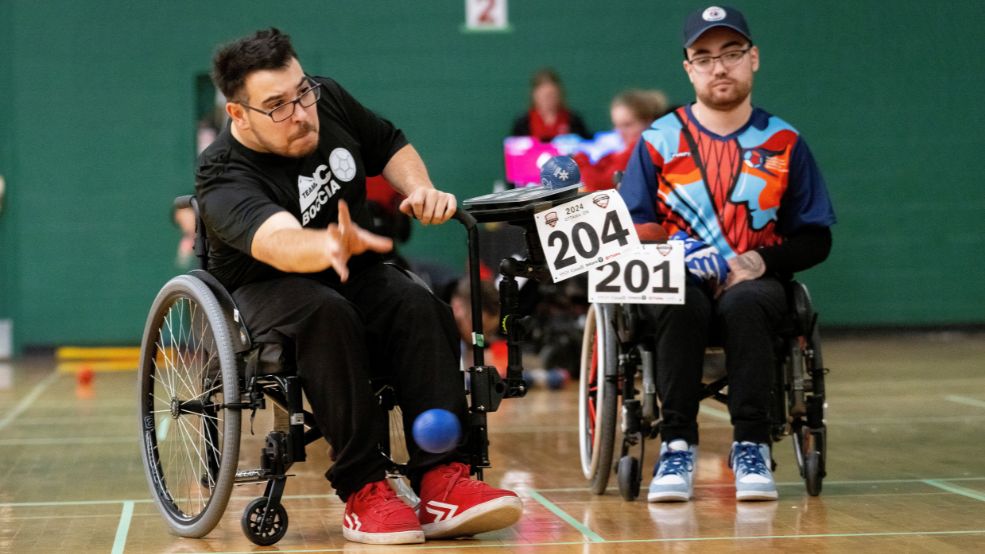 Family stops on bikes to view Parliament Hill and Ottawa River, Special Olympics Ontario School Championships 2025 logo